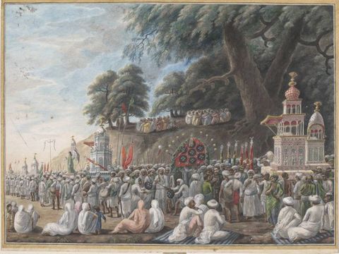 Watercolour. Hundreds of people with brown skin walk in a procession or look on in a landscape with towering trees. Most of the people wear turbans and white garments, though others are in muted green, pale pink, sky blue, or light yellow. A few objects carried along by the crowd resemble buildings.
